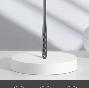 Detail view of the ergonomic gray long handle with non-slip grooves and a hanging hole
