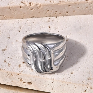 Unisex wide silver stainless steel ring with wave relief on natural stone base