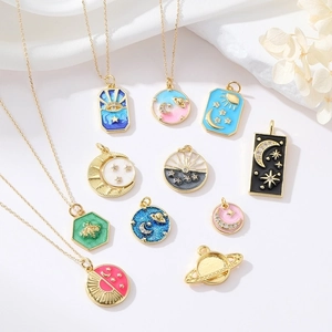 Vintage 14k gold plated enamel celestial pendants with moon, star and sun designs
