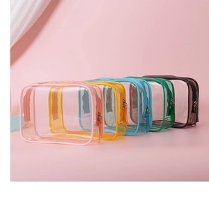 Transparent PVC makeup bags with five colored zippers showing large storage capacity