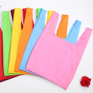 Foldable oxford fabric shopping bags in multiple colors like pink, blue, and orange