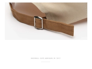 Detail of adjustable metal buckle and contrast strap on a cotton baseball cap