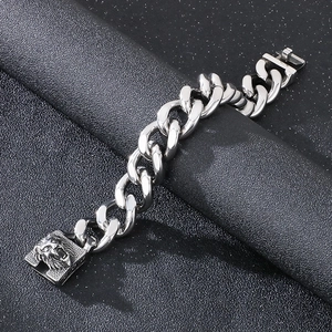 Silver stainless steel Cuban link bracelet featuring a bold lion head clasp with diamonds