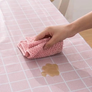 Pink checkered PEVA tablecloth featuring waterproof and easy-to-clean surface with a rag