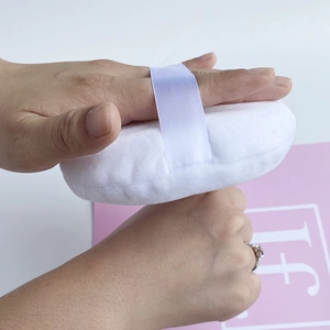 Extra-large velvet powder puff with ribbon handle used for body setting powder