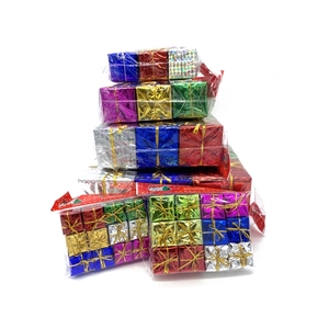 Macro detail of assorted colorful metallic laser Christmas gift box ornaments in various sizes