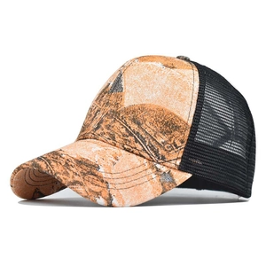 Detail view of tie-dye camouflage canvas panels and breathable black mesh on back of trucker hat