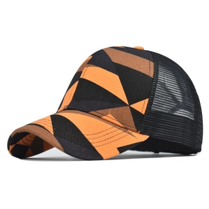 Detail of breathable black mesh back and tie-dye geometric pattern on a sun visor cap