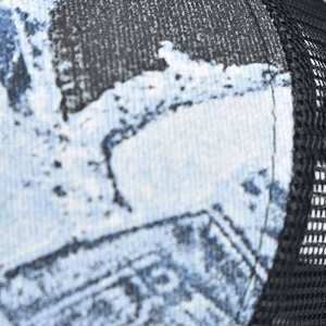 Close-up of breathable black mesh and blue tie-dye fabric with vintage 55 print on the cap