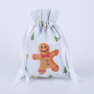 Detail of white gingerbread man Christmas drawstring gift bag with elegant white ribbon
