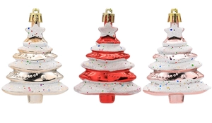 Detailed view of red, gold, and rose gold Christmas tree ornaments with glitter finish