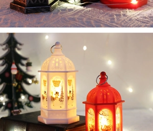 Close-up of LED Christmas lanterns with Santa and Snowman prints on rustic books