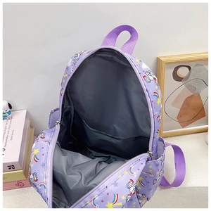 Detail view of the purple unicorn backpack interior showing main compartment and sleeve
