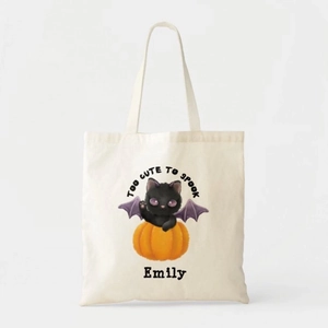 Close-up of Halloween ghost print and customizable name on white canvas tote bag