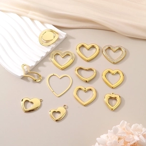 Flat lay of gold hollow heart-shaped charms with rhinestones for DIY jewelry making