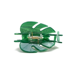 Monstera leaf hair claw clip in green acetate with elegant marble texture pattern