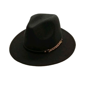Detail of classic black wool felt fedora with a decorative golden chain strap