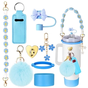 Light blue Stanley cup accessory set with floral strap, bow straw cover, and lipstick pouch