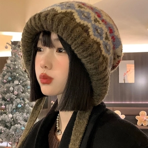 Vintage Fair Isle knit beanie with earflaps and tassels in a warm brown geometric pattern
