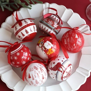 7-piece set of red and white Christmas foam ball ornaments on a white ceramic tray