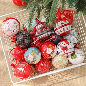 Assorted Christmas ball ornaments with Santa and reindeer motifs in a white wire basket