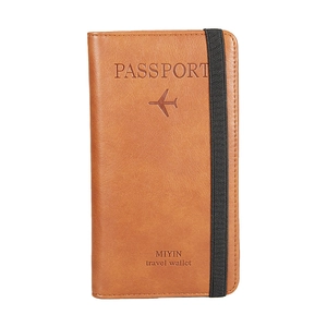 Brown PU leather travel passport holder with RFID blocking and elastic strap closure