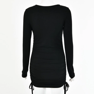 Detail of black ribbed mini dress featuring side drawstrings and ruched adjustable side seams