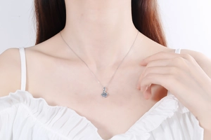 Elegant S925 sterling silver necklace featuring a sparkling square pendant on a female model