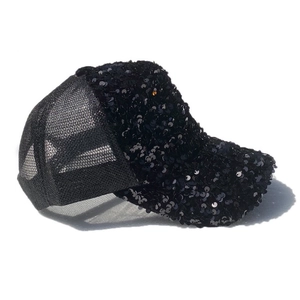 Close-up of black sequined baseball cap with breathable mesh back and wide sun visor