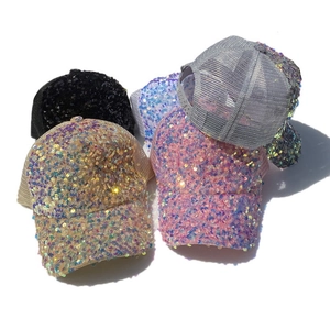 Close-up of glitter sequins and breathable mesh panels on these stylish trucker hats