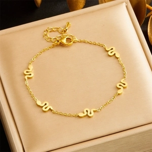 Elegant gold plated snake pendant bracelet with adjustable chain in a jewelry box