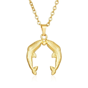 Detailed close-up of double dolphin pendant necklace in polished 18K gold finish