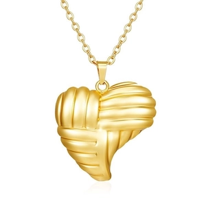 Detailed view of gold heart pendant with unique woven texture and polished 18K finish