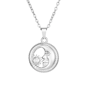 Detail of silver sun and moon pendant necklace in minimalist stainless steel design