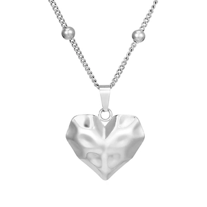 Detailed close-up of textured heart pendant necklace with beaded stainless steel chain