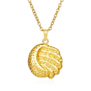 Macro shot of 18K gold plated necklace showing detailed textured round pendant