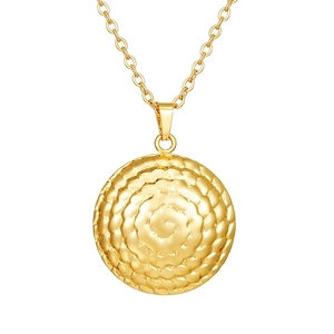 Detail of 18K gold-plated necklace featuring a round pendant with spiral wave texture