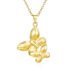 Detailed macro view of 18K gold double butterfly pendant with textured metal finish