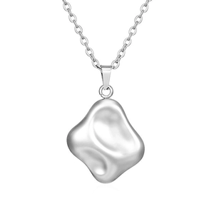 Close-up of minimalist silver necklace with liquid metal irregular pendant detail