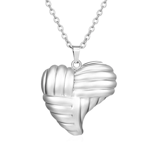 Macro detail of silver woven heart pendant with polished finish on an O-chain necklace