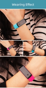 Blue and rose red LED digital wristbands shown on wrist with flexible silicone straps