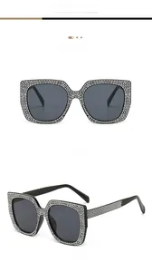 Detail view of square oversized cat eye sunglasses with rhinestones on black frames