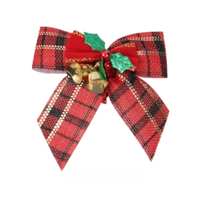 Detail of Christmas plaid bow with golden bells and green holly leaves on white background