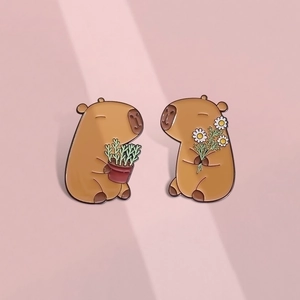 Cute capybara enamel pin set with flower and plant motifs for backpacks and accessories