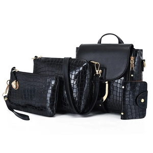 Detail of 4-piece black crocodile pattern handbag set including backpack and purses