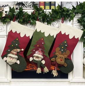 Detailed view of Christmas stockings with 3D Santa, Snowman and Reindeer characters