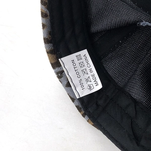 Detail shot of the cotton lining and leopard print brim on a baseball cap