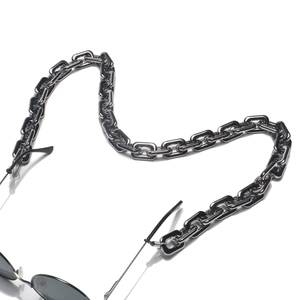 Detailed macro view of dark grey thick rectangular chain links for eyewear fashion