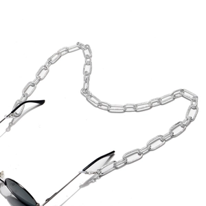 Polished silver textured thick aluminum glasses chain with black sunglasses on white background