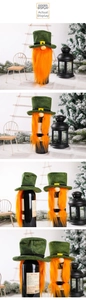 Detail of St. Patrick's Day gnome wine bottle cover with green hat and orange beard